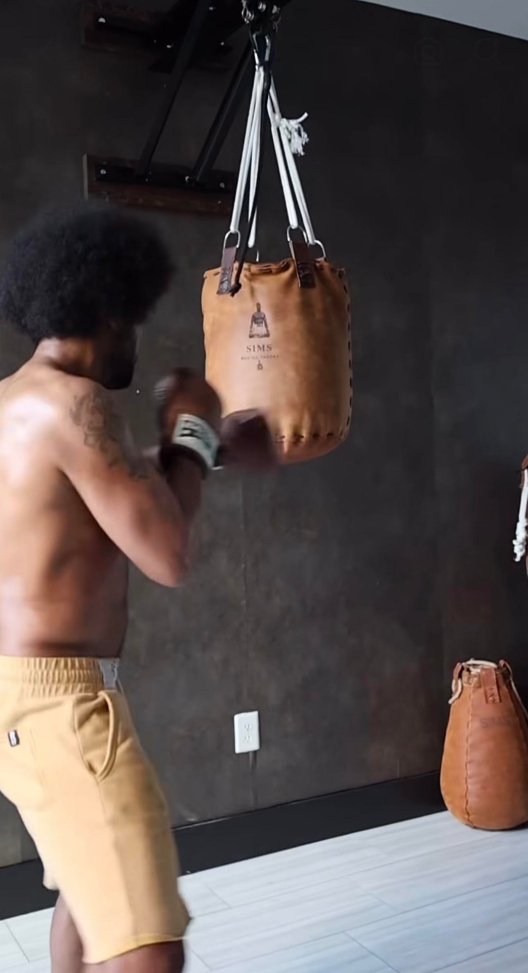 Anthony Sims Jr. wearing Henderson Boxing OS-1 bag mitts